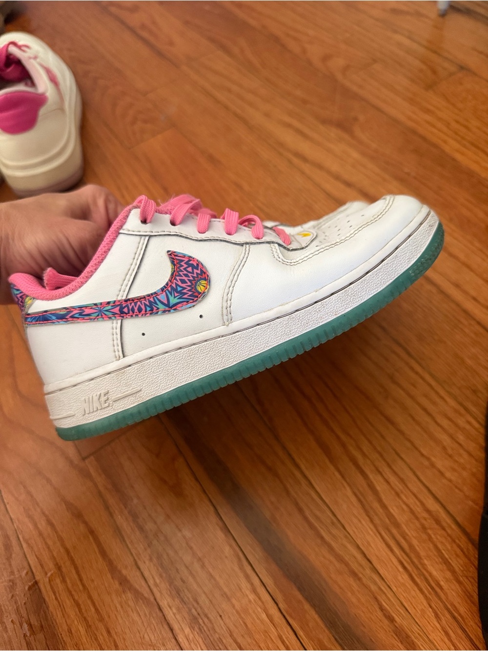Nike Kids White Sneakers with Pink Accents and Teal-Green Sole